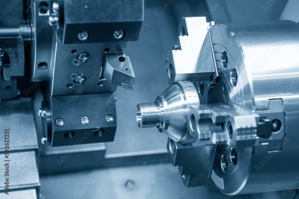 The CNC lathe machine thread cutting the metal shaft part. The hi-accuracy part manufacturing process by turning machine. The CNC lathe machine thread cutting the metal shaft part. The hi-accuracy part manufacturing process by turning machine.