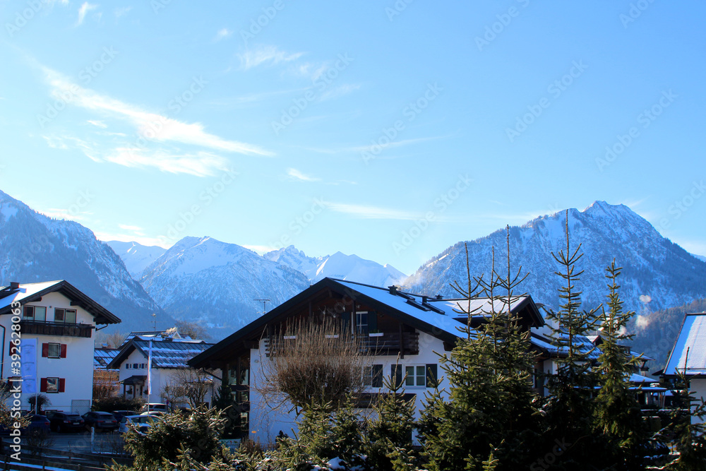 Bavarian residential homes with wooden balconies at the foot of the Alps (Oberstdorf, Germany)
