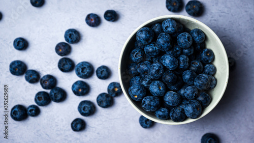 Fresh blueberries in a bowl with white background
