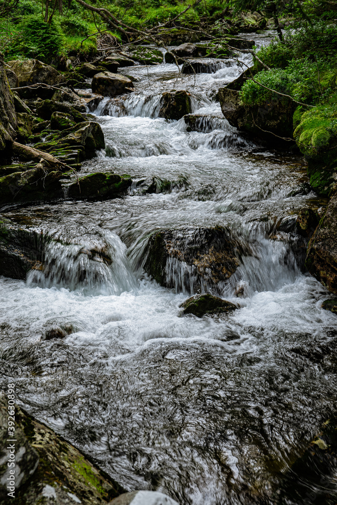 Stream of a creek with cascades