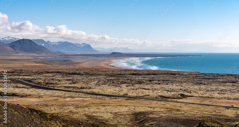 Ocean beach view from Rauðfeldsgjá Gorge Rauofeldsgja ravine (Snaefellsbaer) in a scenic sunny spring day