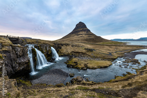 Scenic image of Iceland. Incredible Nature scenery during sunset. Great view on famous Kirkjufell Mountain  with colorful  dramatic sky. popular place for photographers. Best famous travel locations