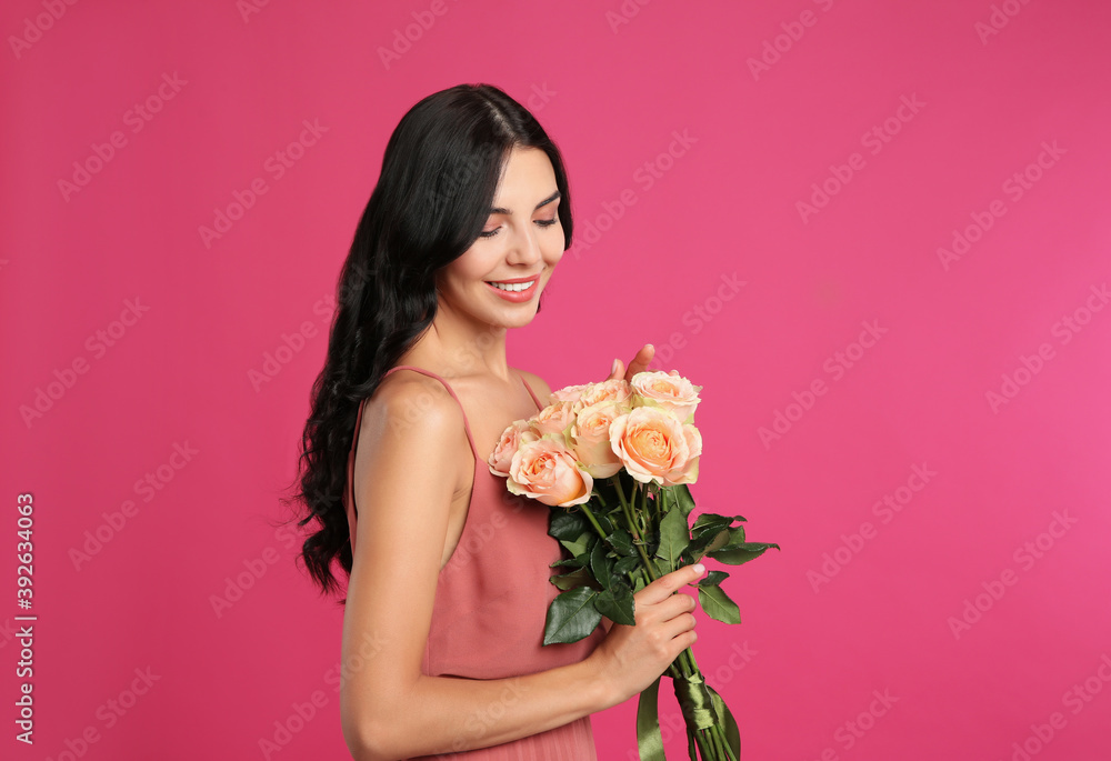 Portrait of smiling woman with beautiful bouquet on pink background Portrait of smiling woman with beautiful bouquet on pink background