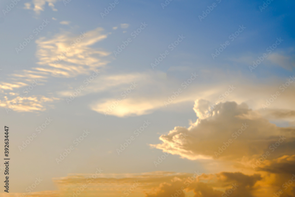 Landscape fantastic Sunset or sunrise with rays of light through the sky. Beautiful white clouds and blue sky high definition skyscraper with grunge texture for background Abstract,nature art style,