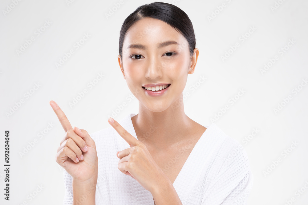Beautiful Attractive Asian young women smile and pointing to copy space for display Cosmetics product feeling happiness with Healthy Clean and Fresh Skin,Isolated on white background,Beauty Concept Beautiful Attractive Asian young women smile and pointing to copy space for display Cosmetics product feeling happiness with Healthy Clean and Fresh Skin,Isolated on white background,Beauty Concept