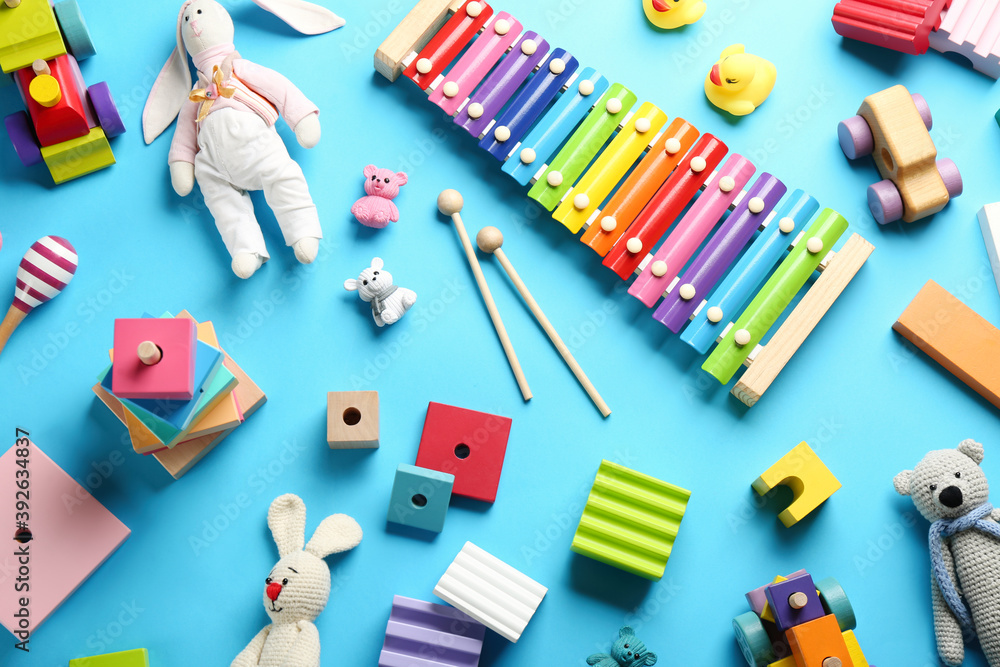 Flat lay composition with different toys on light blue background Flat lay composition with different toys on light blue background