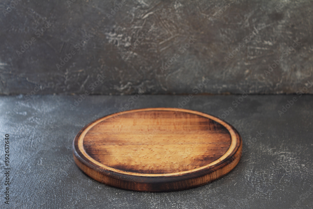 Obraz premium pizza cutting board at stone table