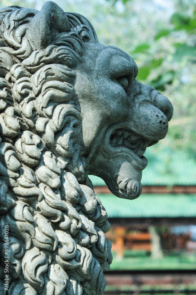 The side of the lion statue in the thai temple