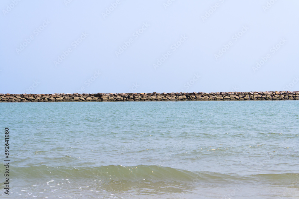 Wave protection rock formations on the beach Wave protection rock formations on the beach