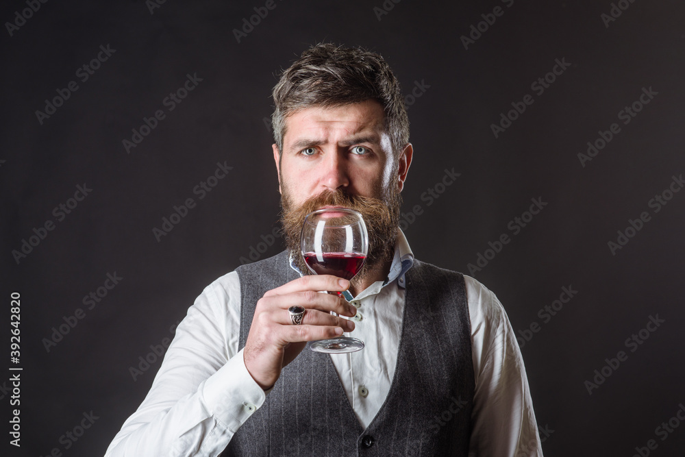 Wine glass. Tasting alcohol. Red wine. Man with alcohol. Bearded man with glass of wine. Man drinks red wine. Man with Bordeaux. Wine glass. Tasting alcohol. Red wine. Man with alcohol. Bearded man with glass of wine. Man drinks red wine. Man with Bordeaux.