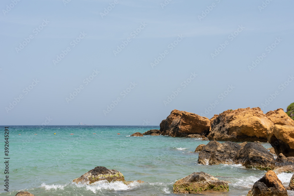 Big rocks in the Mediterranean Sea. Ramla Bay beach, Gozo Island, Malta. Selective focus. 