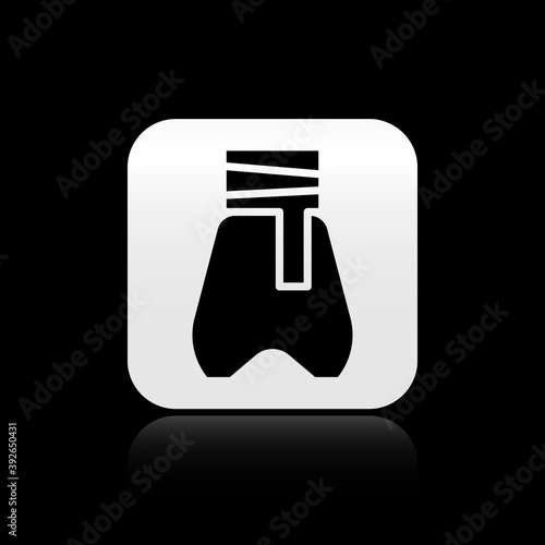 Black Cossack pants with a belt icon isolated on black background. Cossack bloomers. Silver square button. Vector.