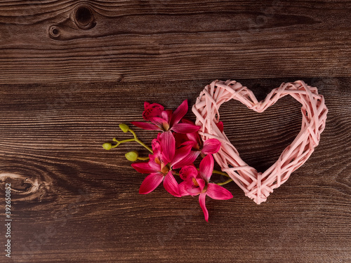 Wicker heart decoration on grunge wooden background valentine s day concept