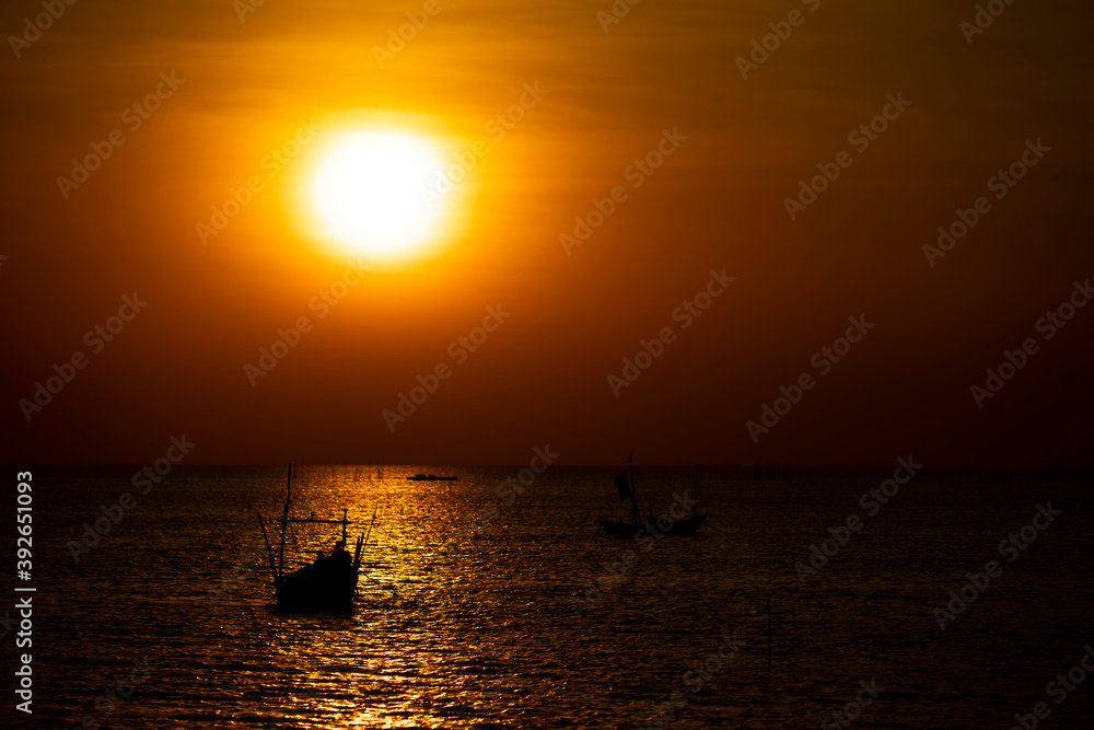 silhouette of Fishing boat At sunset On the coast of Thailand silhouette of Fishing boat At sunset On the coast of Thailand