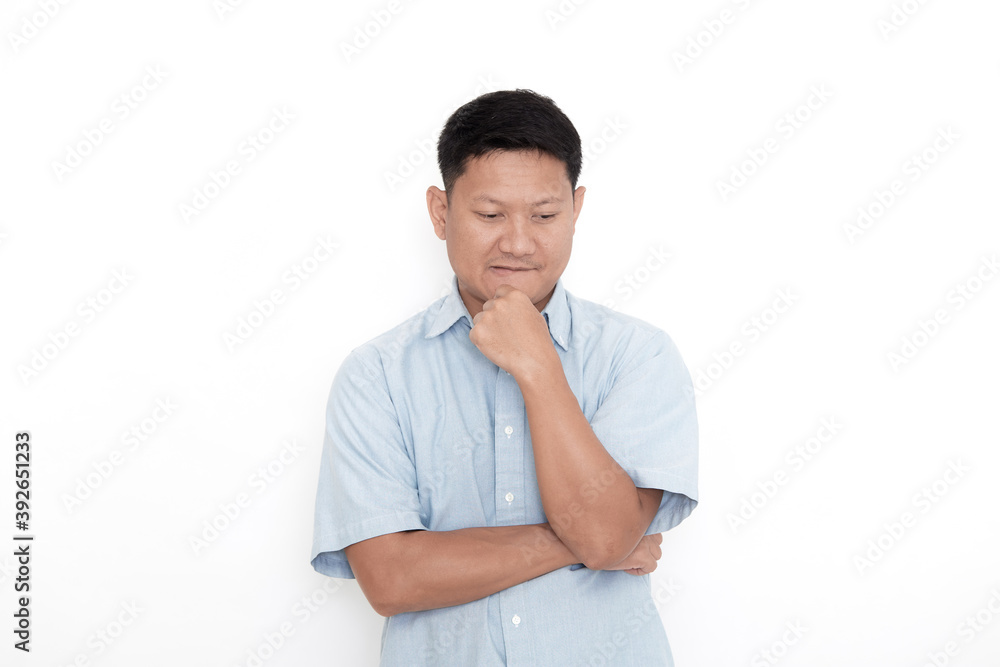 A young Asian man thinking with a confused expression A young Asian man thinking with a confused expression