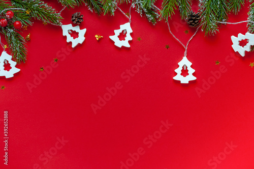 Fir branches and a garland in the shape of a Christmas tree.Christmas or new year background.