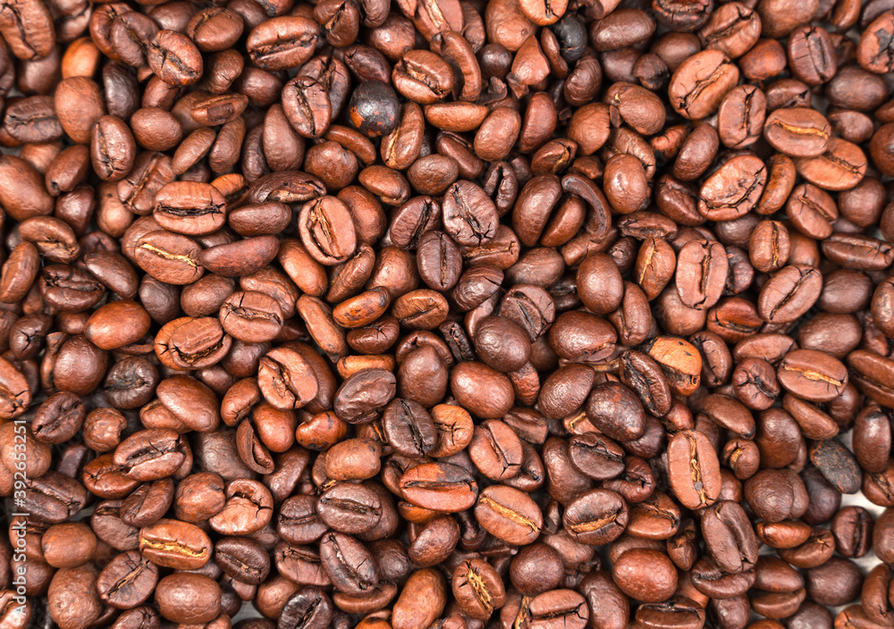 Roasted coffee beans, top View, background. Concept of food funds. Roasted coffee beans, top View, background. Concept of food funds.