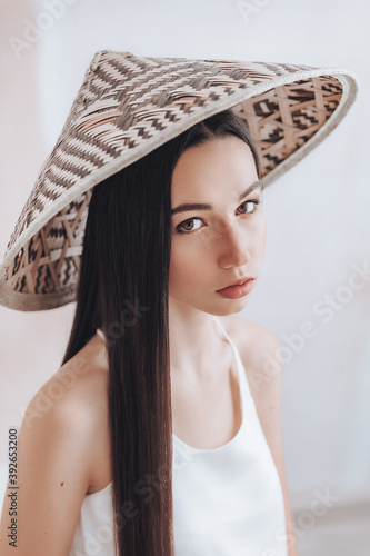 Portrait of beautiful young girl with natural beauty. Girl in bamboo vietnamese hat