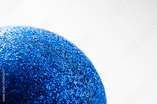 Defocused blue glitter texture surface christmas ball abstract background. Selective soft focus  shallow depth of field.