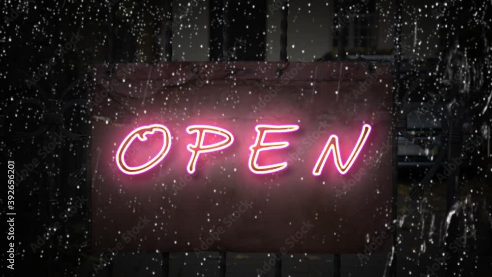 The sign that says "open" lights up in neon and goes out, raindrops