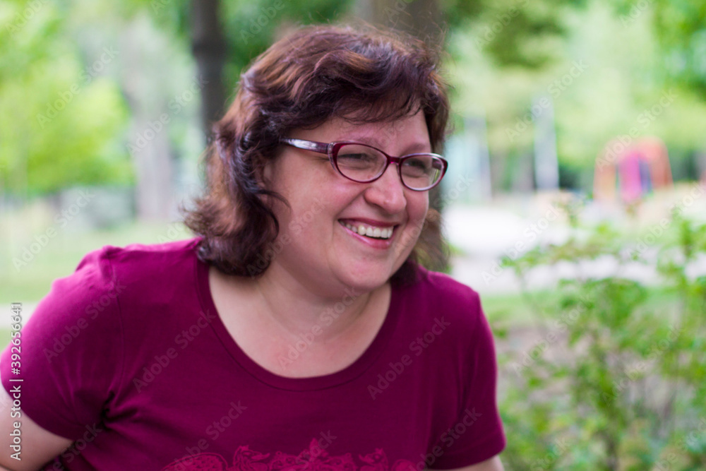 portrait of a young laughing grandmother in glasses portrait of a young laughing grandmother in glasses