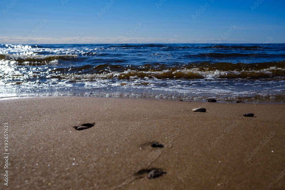 sea shore in summer beach with blue water waves and sand sea shore in summer beach with blue water waves and sand
