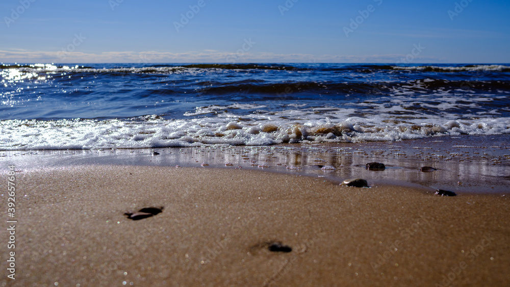 sea shore in summer beach with blue water waves and sand sea shore in summer beach with blue water waves and sand