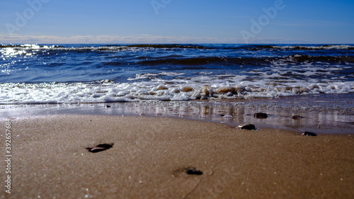 sea shore in summer beach with blue water waves and sand