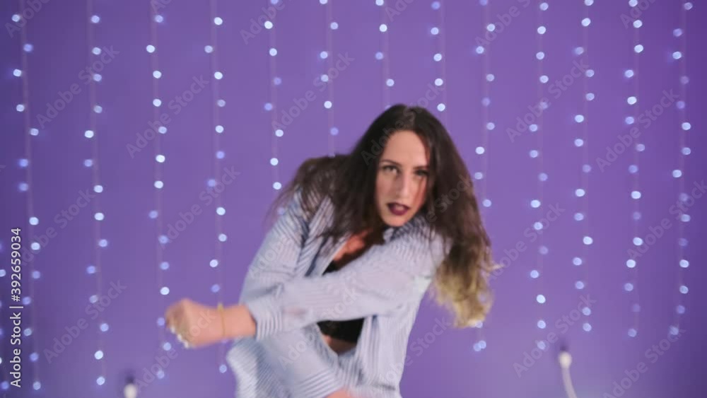 Stylish woman dancing modern dance in a choreographic studio. Slow motion. Stylish woman dancing modern dance in a choreographic studio. Slow motion.