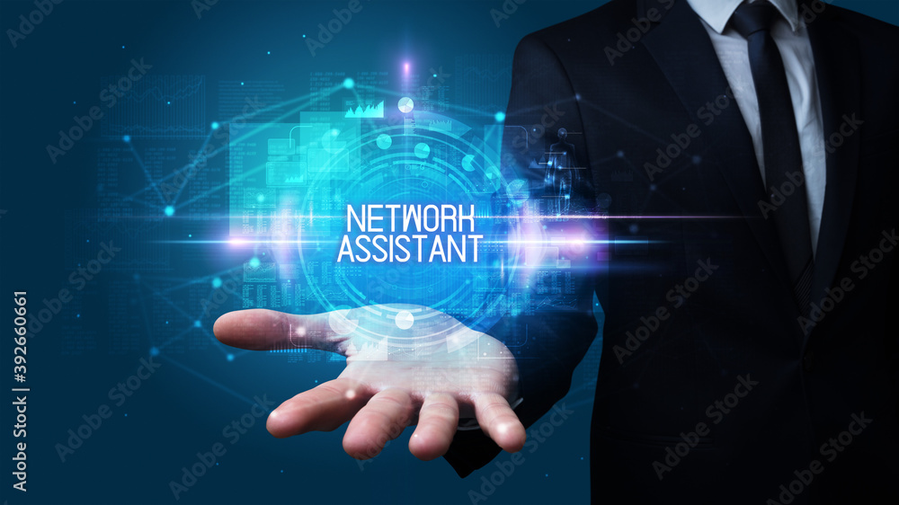 Man hand holding NETWORK ASSISTANT inscription, technology concept Man hand holding NETWORK ASSISTANT inscription, technology concept