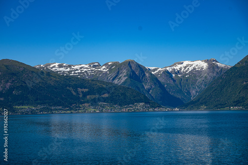 Mountains in the distance at a fjord © Friethjof