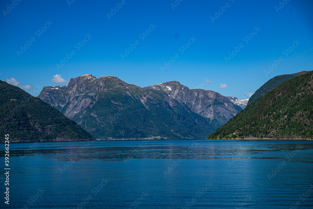 Mountains in the distance at a fjord Mountains in the distance at a fjord