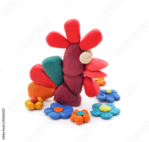 Plasticine flowers and rooster.