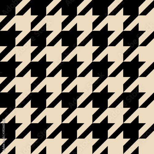 Houndstooth pattern seamless. Checkered background in black and ivory color. Vector design. Geometric backdrop.