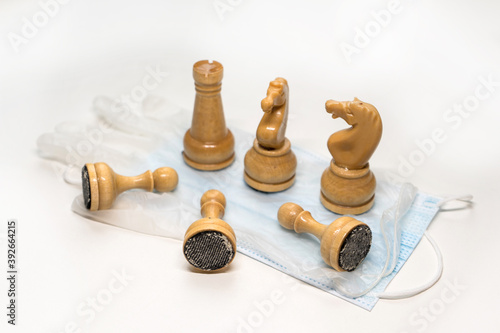 wooden chess pieces on the Medecin mask
