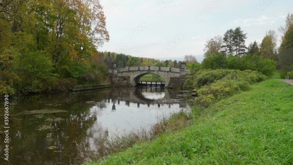Pavlovsk park in autumn, St. Petersburg, Visconti bridge spanning the Slavianka river Pavlovsk park in autumn, St. Petersburg, Visconti bridge spanning the Slavianka river