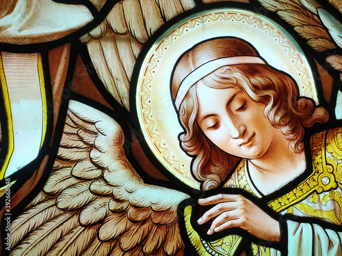 Photography Christmas magic scene with angels. Stained glass window detail.
