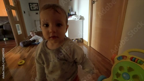 boy playing camera cover with plastic bottle