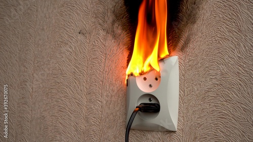 Fire caused by short circuit. The concept of a fire in the house.