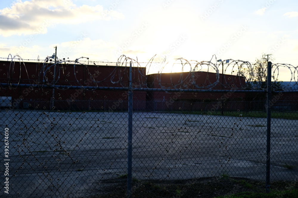 barbed wire fence sunset warehouse in louisiana barbed wire fence sunset warehouse in louisiana