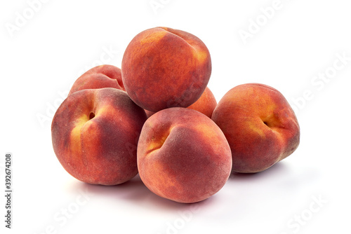 Fresh peaches, isolated on white background
