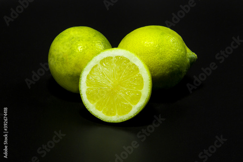 Yellow green limes for ingredients in black label background 