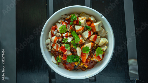 Rice bowls, rice noodles tomatoes, basil, pesto, cheese, chicken breast, and chili con carne 