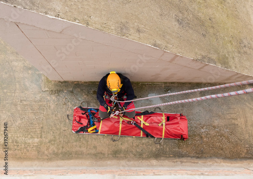 rescue firefighter ascending with stretcher