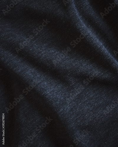 Closeup of dark textured fabric.