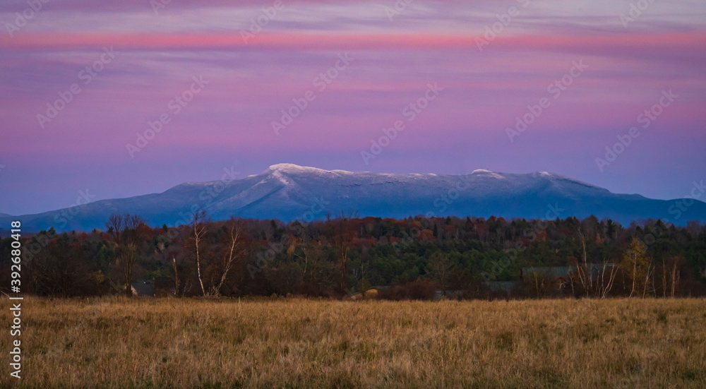 Obraz premium evening dusk lights up snow dusted Mount Mansfield in Vermont 
