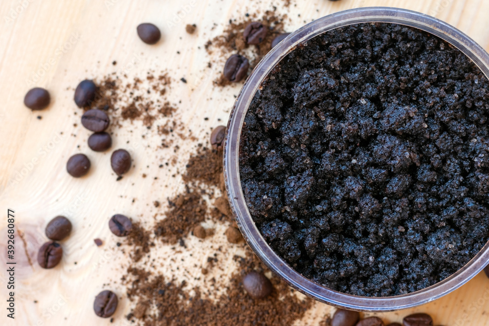 Bowl full of ground coffee scrub with olive oil and salt as homemade