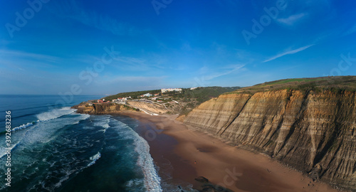 Aerial view of waves on a beautiful sandy ocean beach 