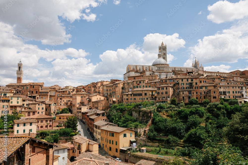 Panoramic view of Siena city with historic buildings and street