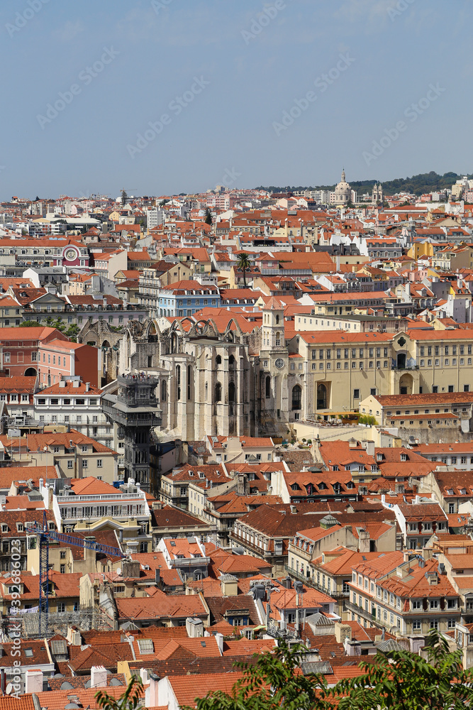 Aerial vertical shot of the landscape of Lisbon, Portugal under a clear blue sky